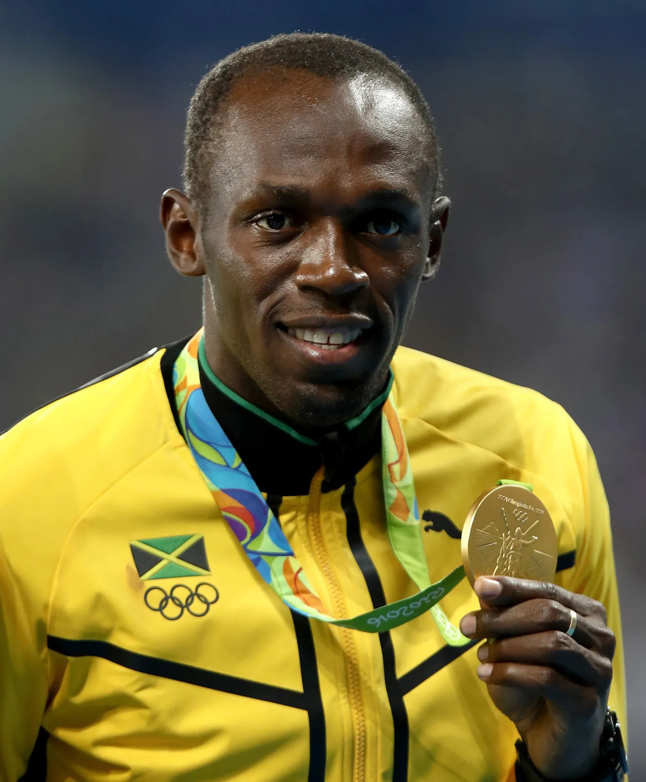 Ez Usain Bolt, amint megnyeri utolsó olimpiai 100 méteres versenyét a 2016-os riói olimpián. 